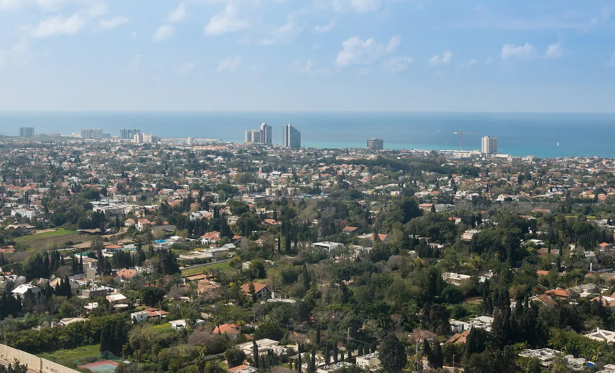 Aerial view of Herzliya Pituach: villas, the hotel strip and the coast